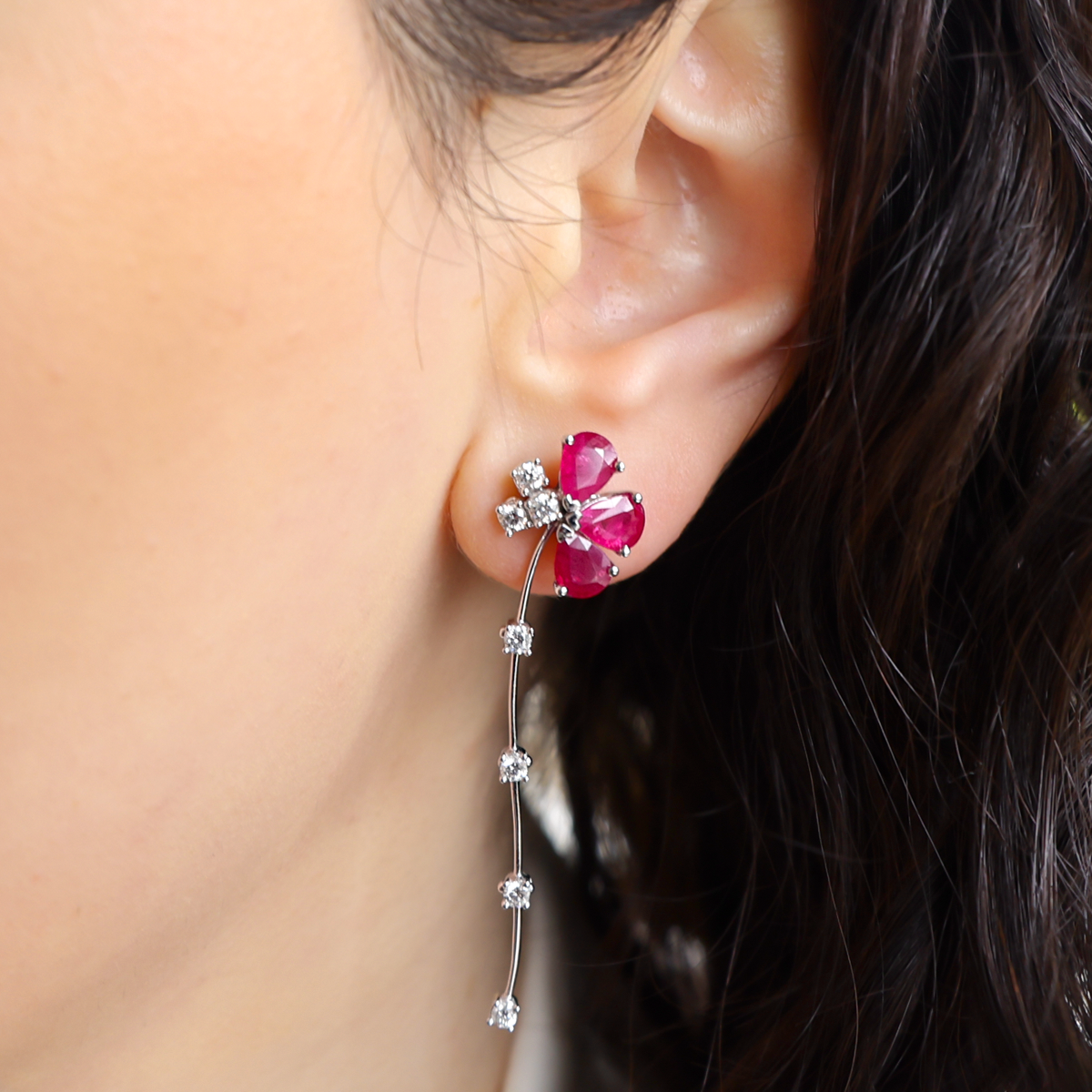 Model wears 18ct White Gold Ruby & Diamond Floral Drop Earrings