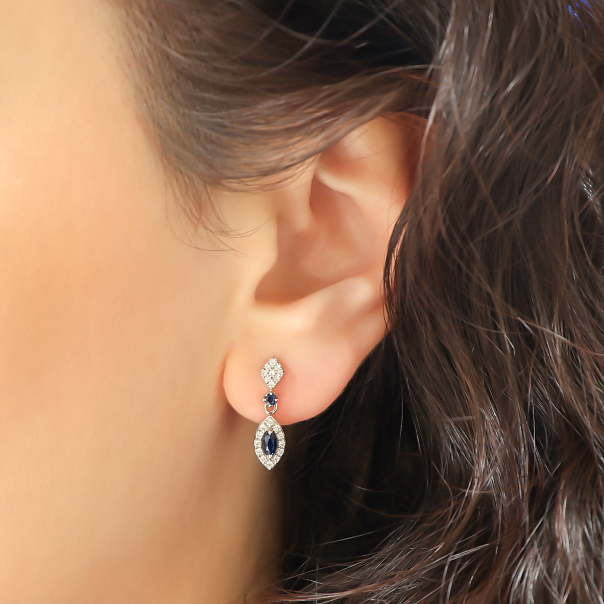 Model wears 9ct White Gold Sapphire & Diamond Marquise Cluster Drop Earrings