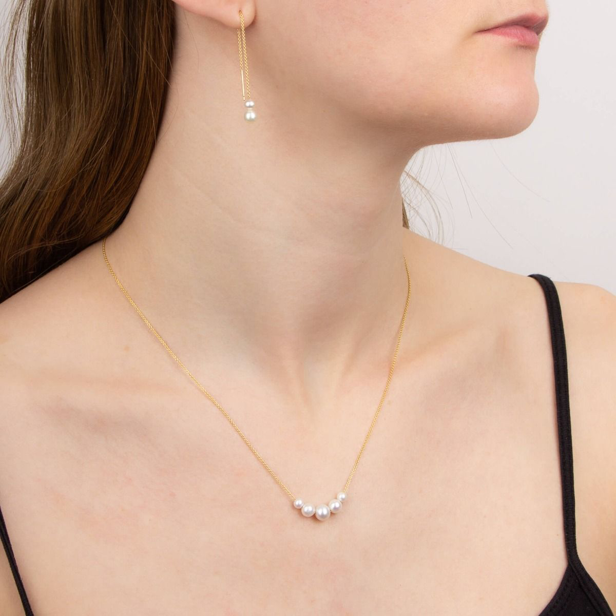 Model wears 9ct Yellow Gold Freshwater Pearl Rolo Chain Necklace & Earrings