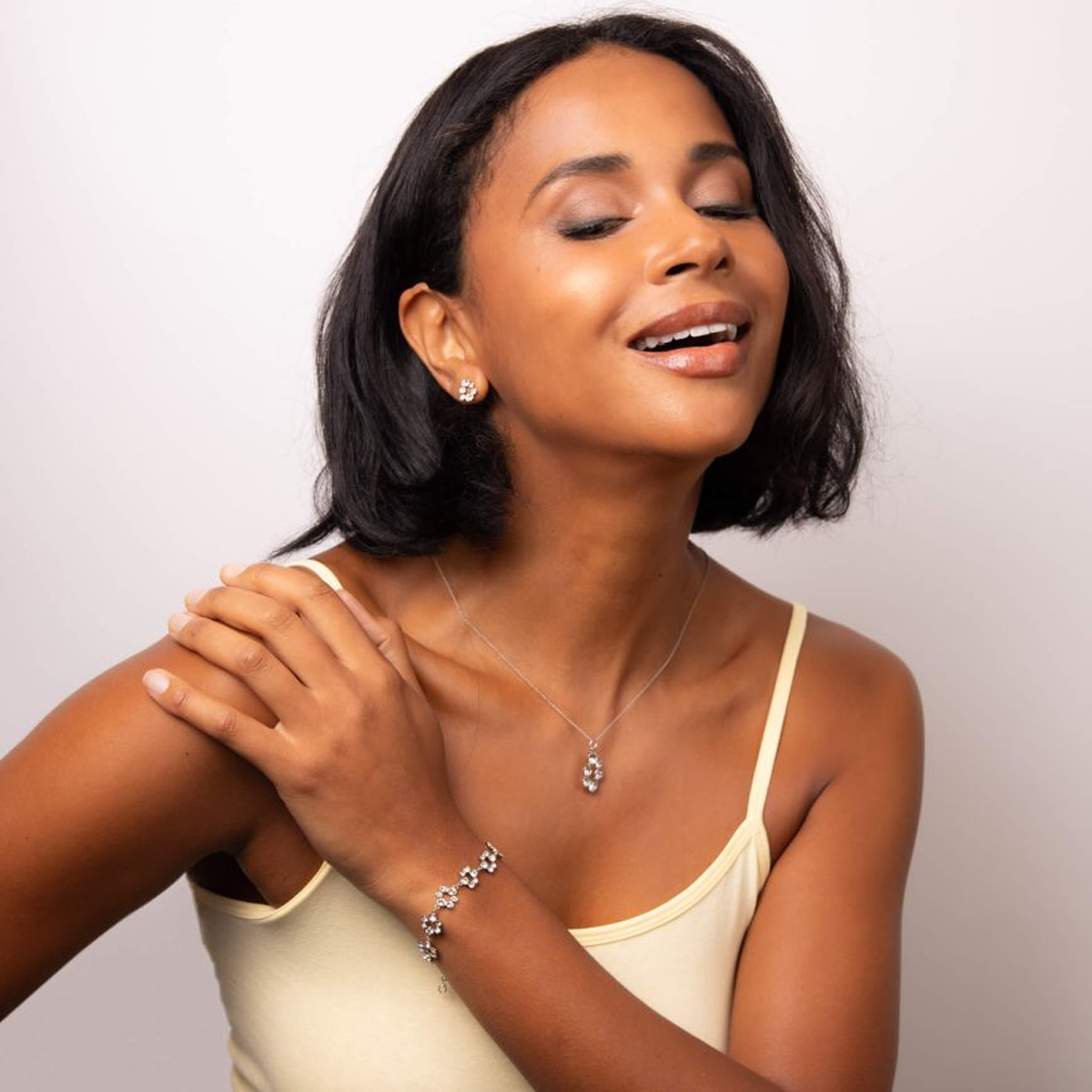 Model wears Sterling Silver Clear Crystal Bubble Pendant & Chain, Earrings & Bracelet