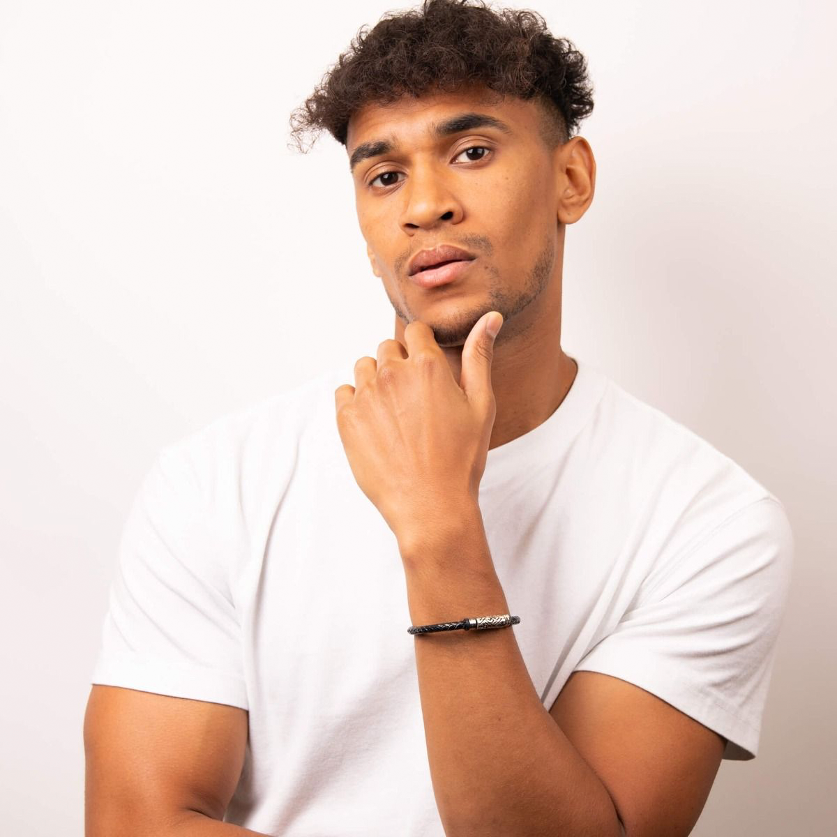 Model wears Stainless Steel Detailed Plaited Black Leather Bracelet