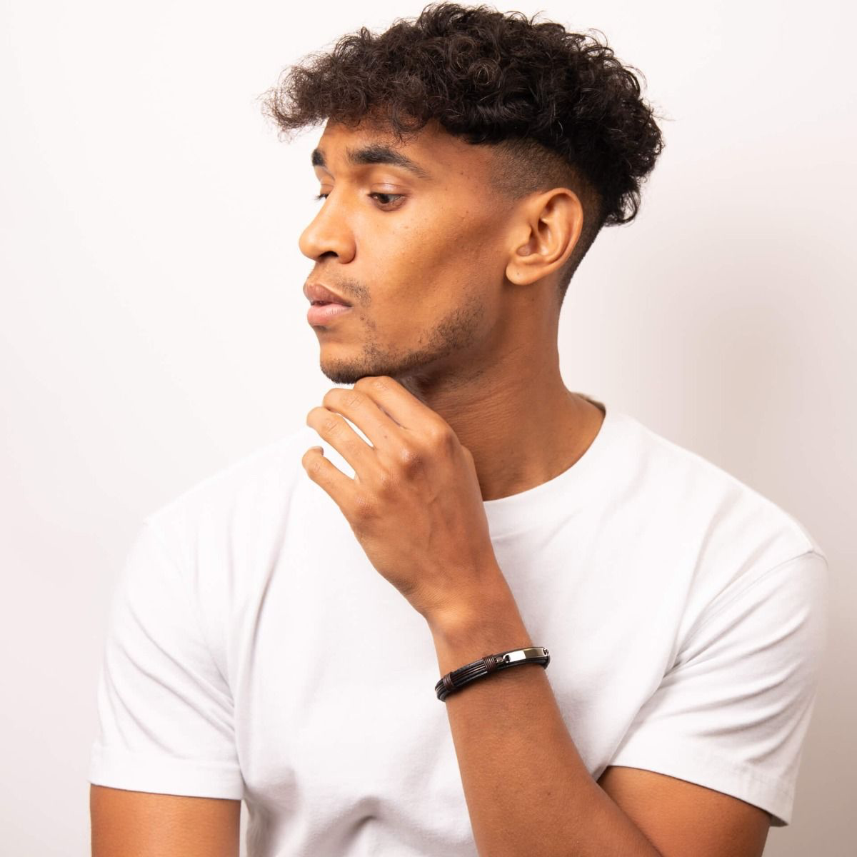 Model wears Stainless Steel ID Bar Black Leather Bracelet With Brown Cord Detail
