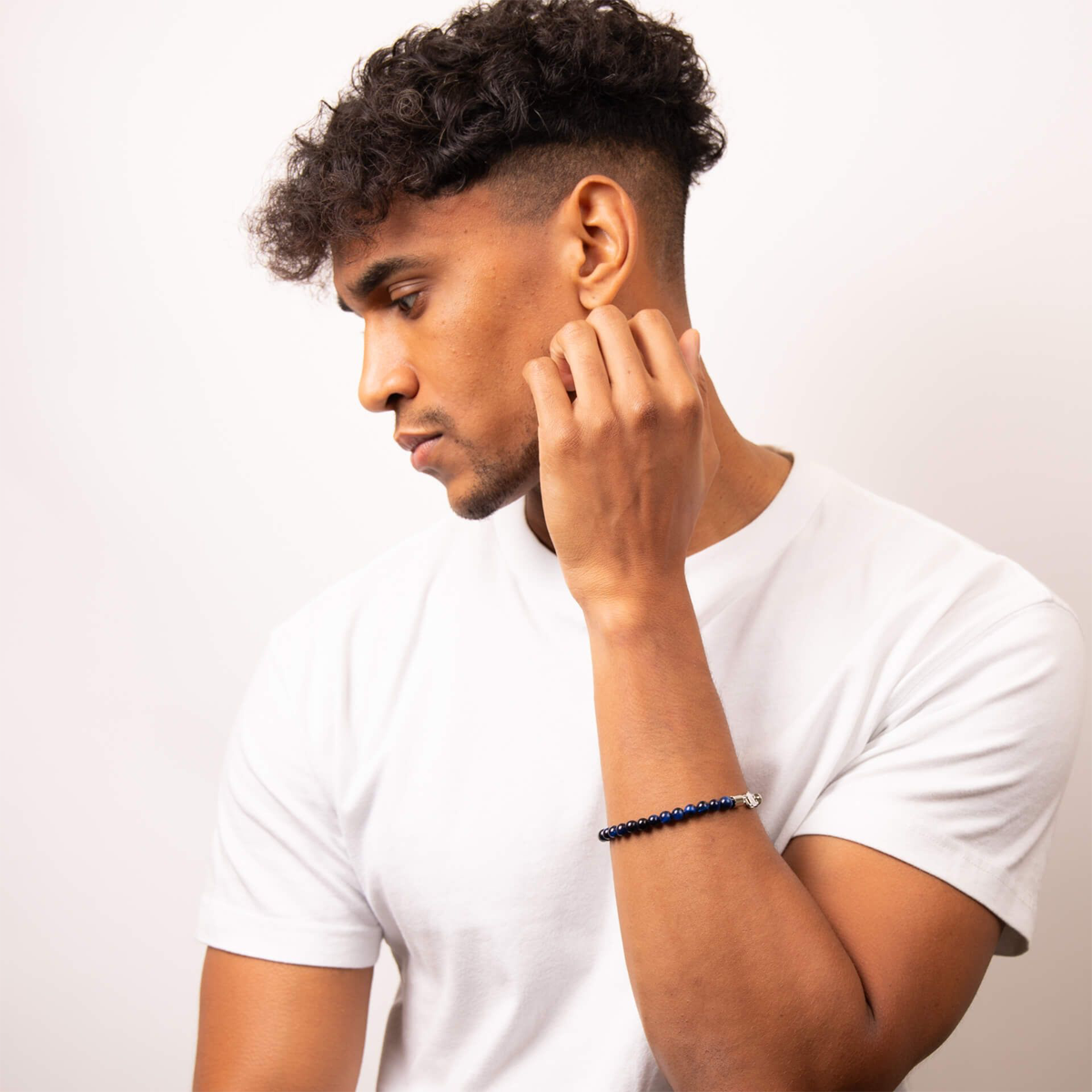 Model wears Stainless Steel Blue Tiger’s Eye Beaded Bracelet
