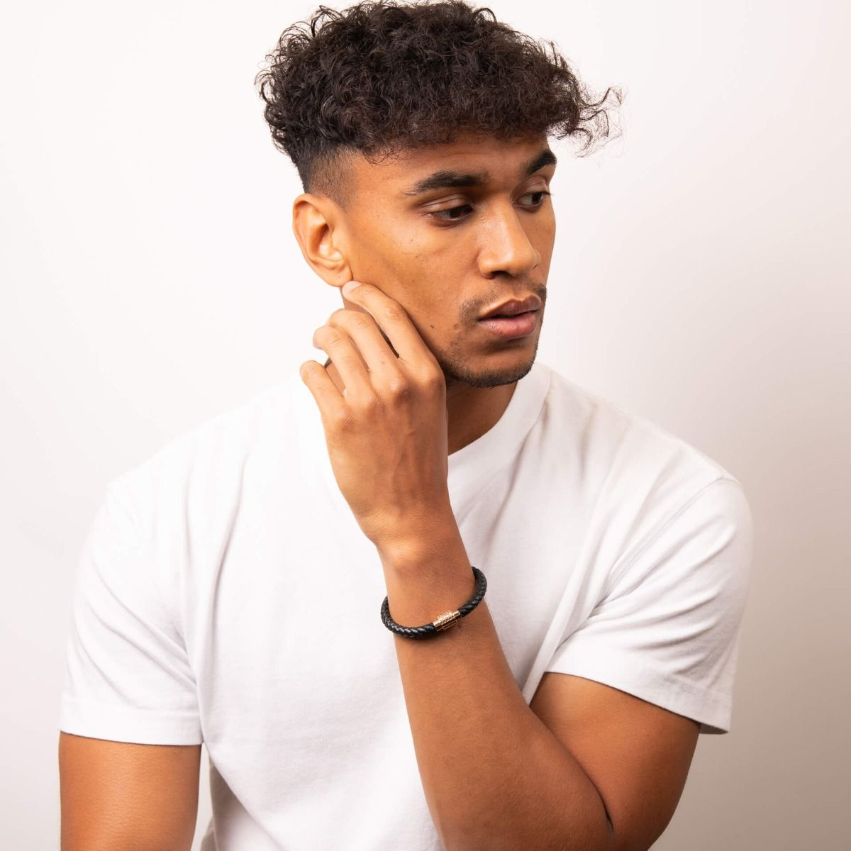 Model wears Black Leather Plait Bracelet with Hexagon Ridge Clasp