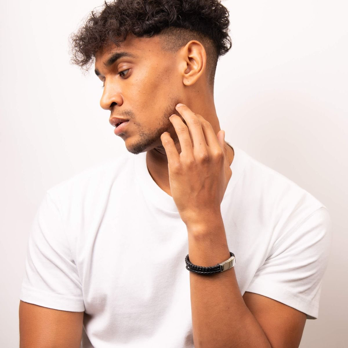 Model wears Multi Row Recycled Black Leather Bracelet with Lava Beads