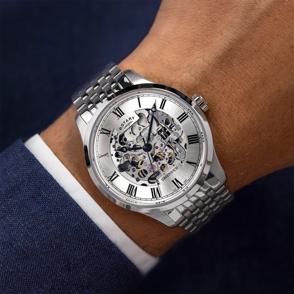 Model wears Rotary Greenwich Skeleton Automatic, Silver Dial with Stainless Steel Bracelet GB02940/06