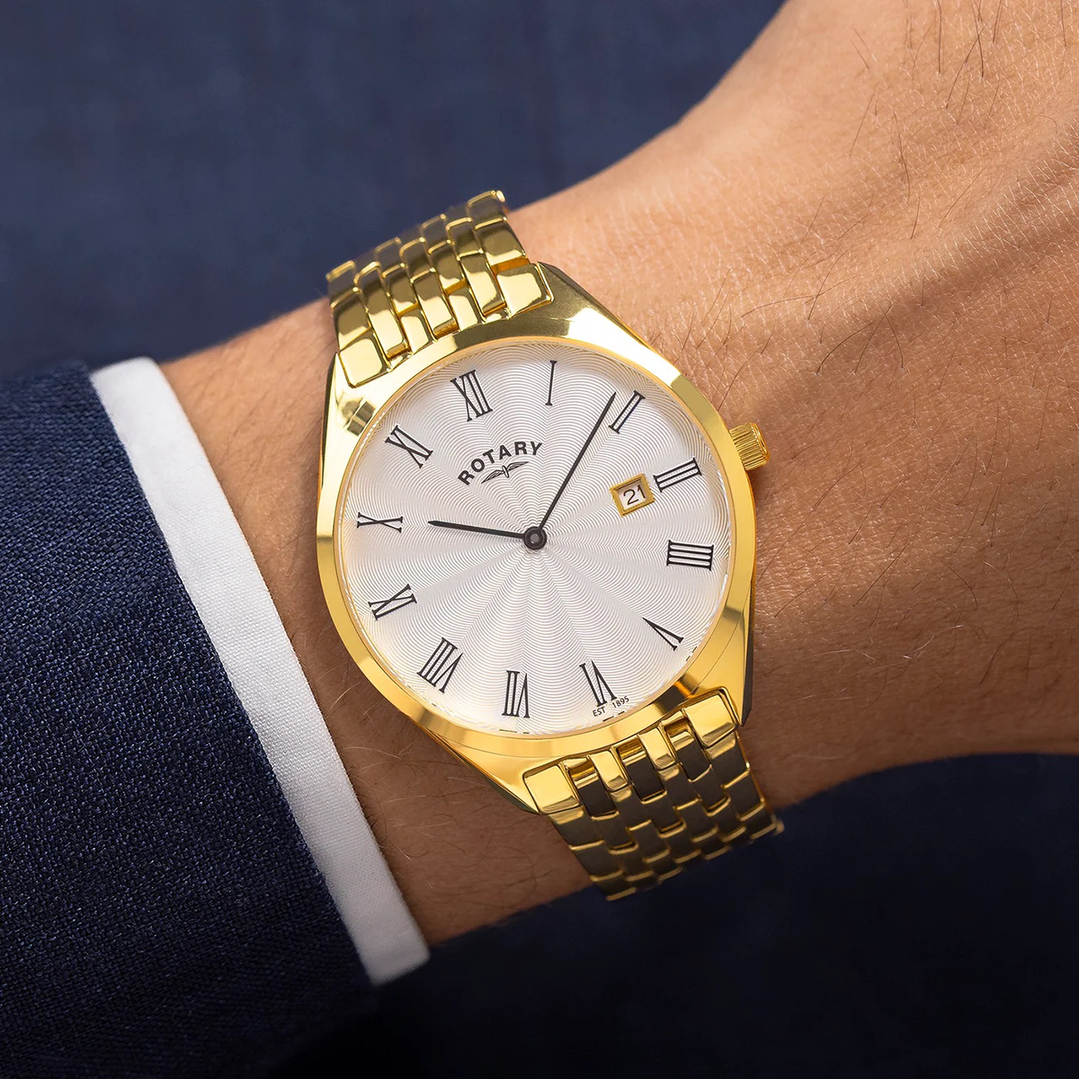 Model wears Rotary Ultra Slim Watch, Silver Dial with Gold Plated Bracelet - GB08013/01 