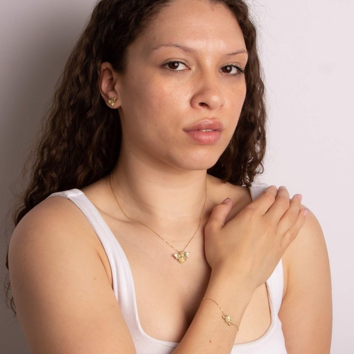 Model wears 9ct Yellow Gold Bee Bracelet, Necklace & Earrings