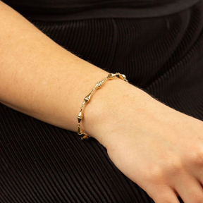 Model wears 9ct Yellow Gold Kite Shaped Link Bracelet