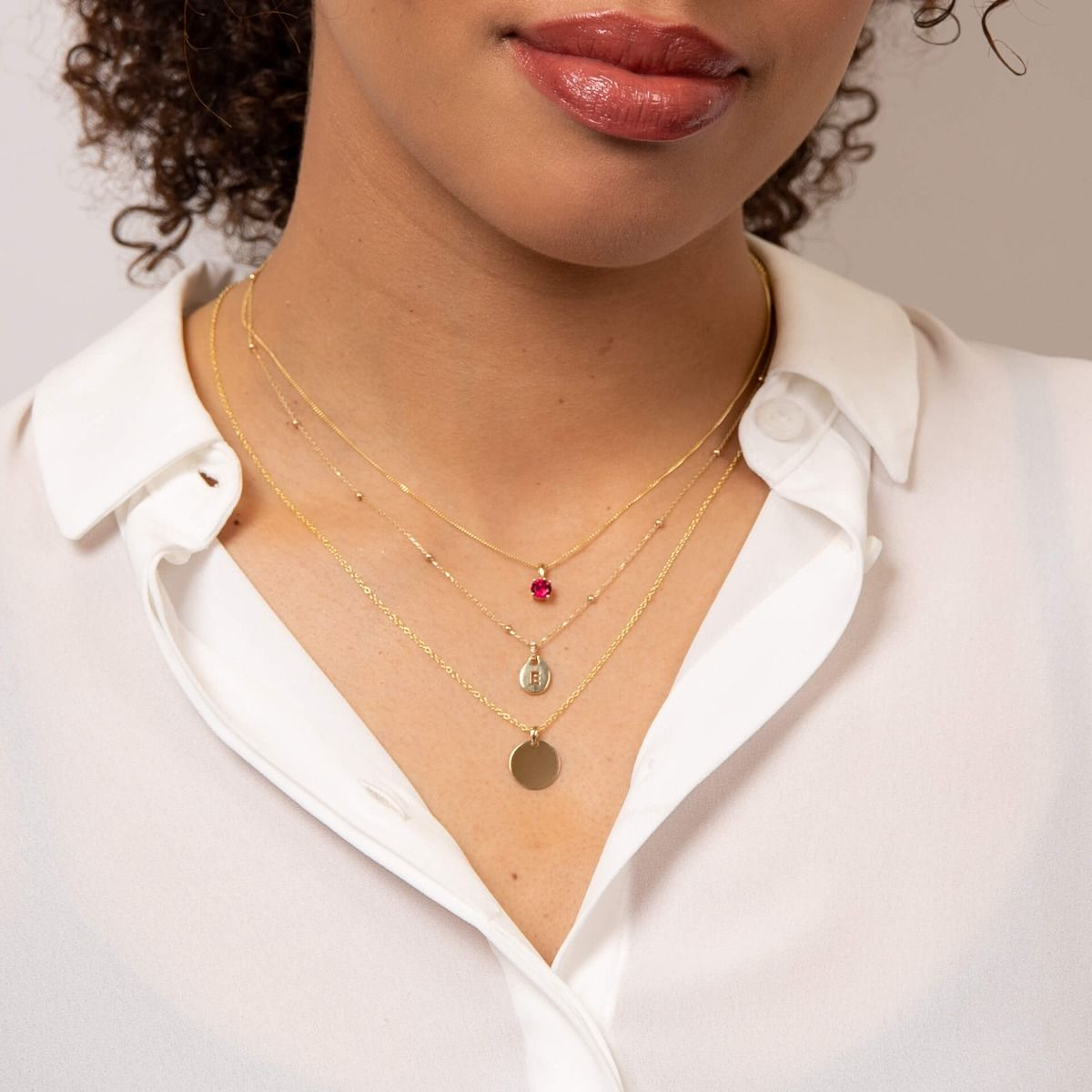 Model wears 9ct Yellow Gold Fine Ball Station Necklace