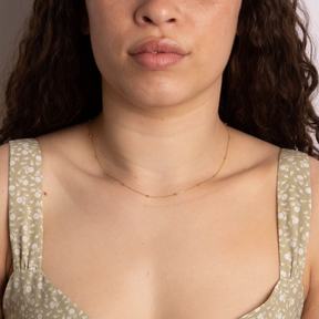 Model wears 9ct Yellow Gold Fine Ball Station Necklace
