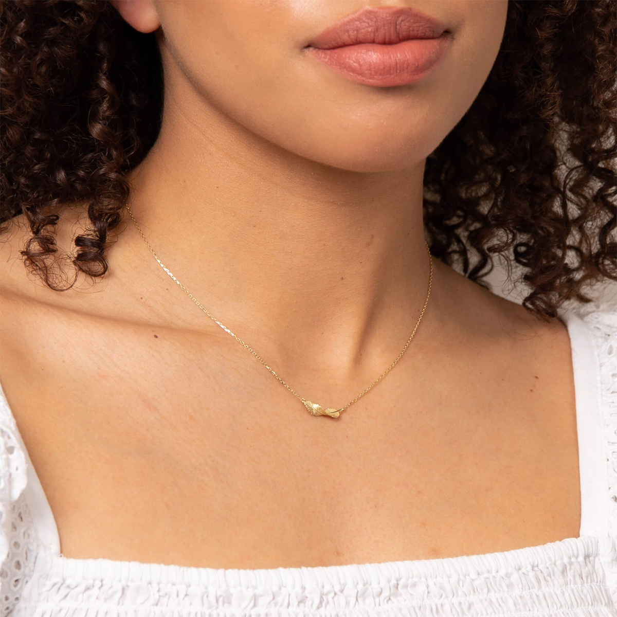 Model wears 9ct Yellow Gold Twist Leaf Necklace