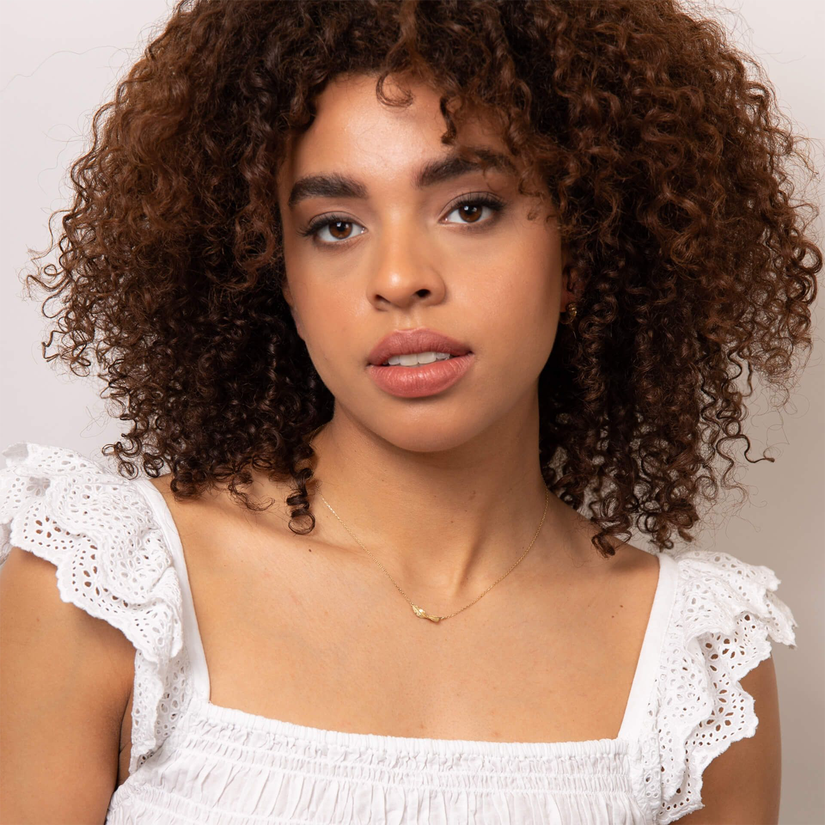 Model wears 9ct Yellow Gold Twist Leaf Necklace