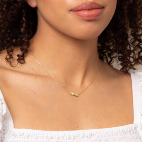 Model wears 9ct Yellow Gold Twist Leaf Necklace