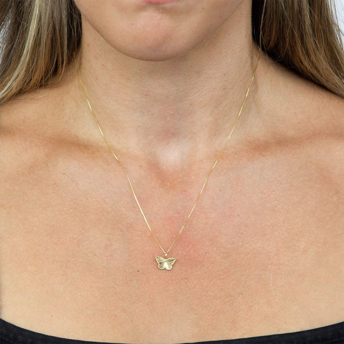 Model wears 9ct Yellow Gold Diamond Cut Butterfly Pendant