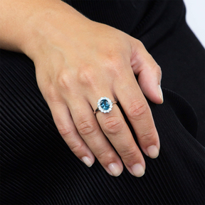 Model wears 9ct White Gold Blue Topaz Cluster Ring