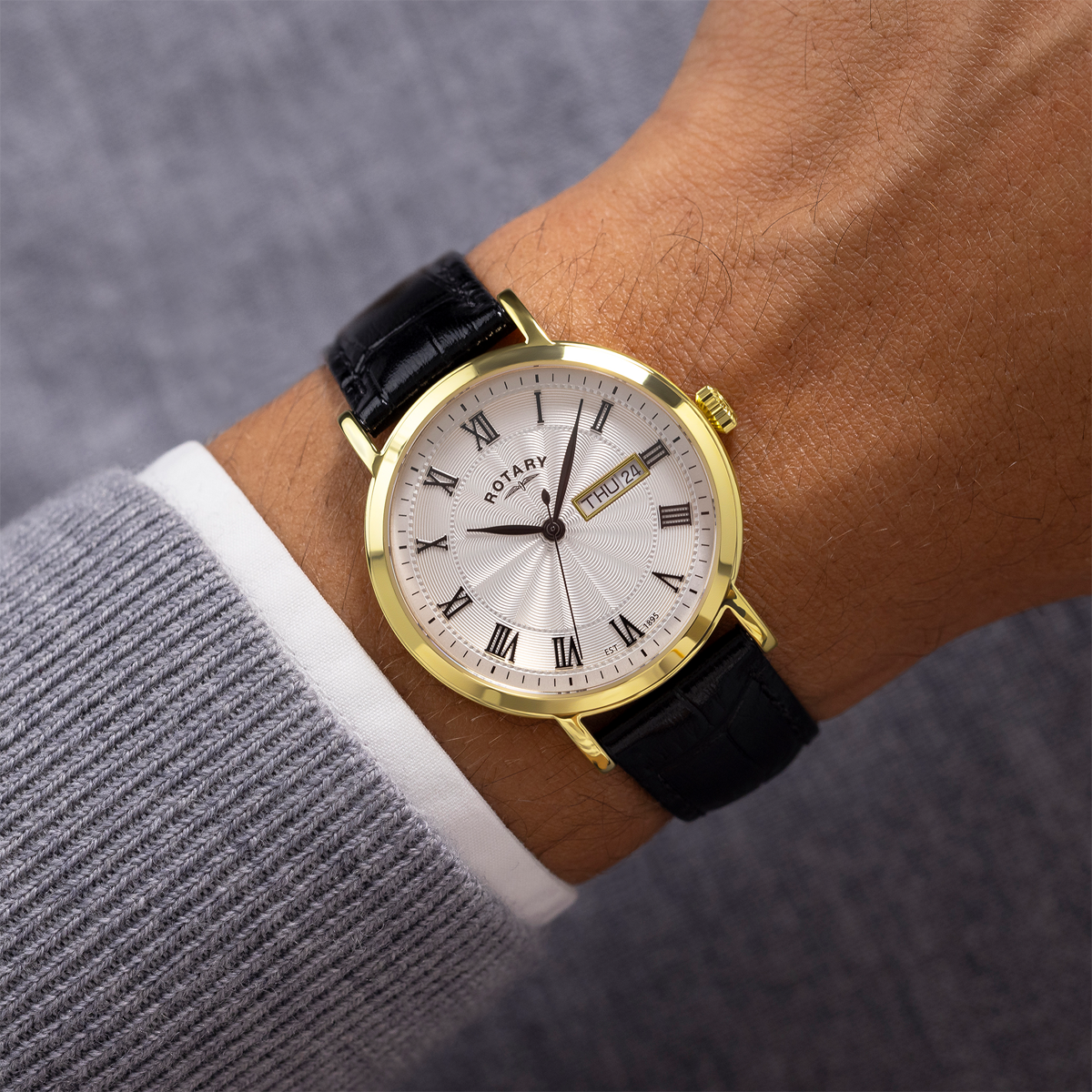 Model wears Rotary Heritage Gold Plated Watch, White Dial with Black Leather Strap - GS05423/01