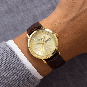 Model wears Rotary Heritage Gold Plated Watch, Champagne Dial with Brown Leather Strap - GS05423/03
