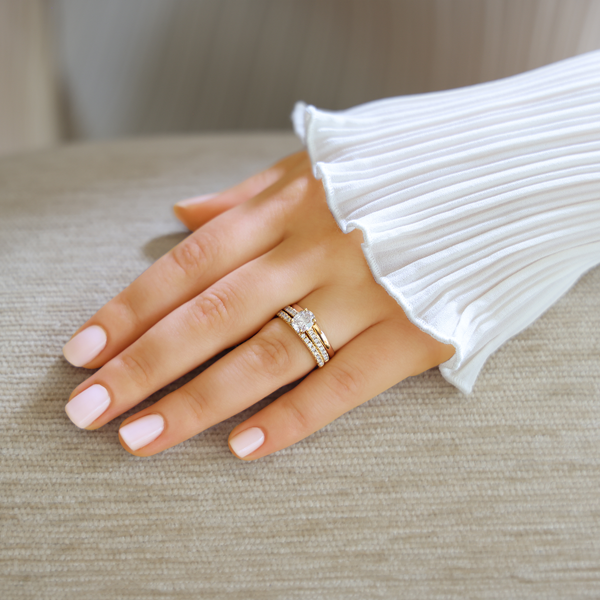 Model wears 18ct Yellow Gold Oval Cut Diamond Solitaire & Shoulder 1.15ctw Ring with Matching Eternity & Wedding Band