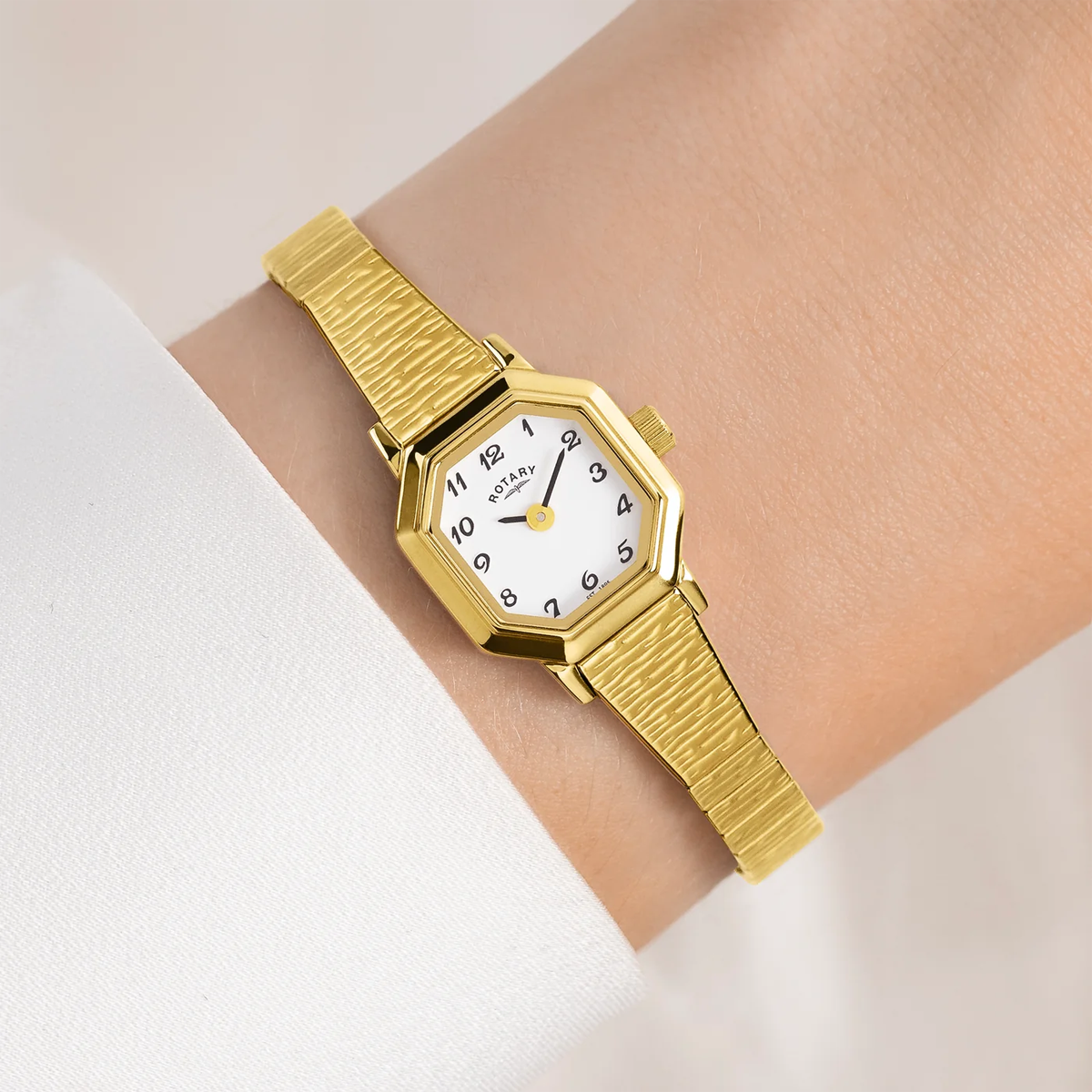 Model wears Rotary Altera Watch, Octagon Shaped White Dial with Gold Plated Bracelet - LB00764/29
