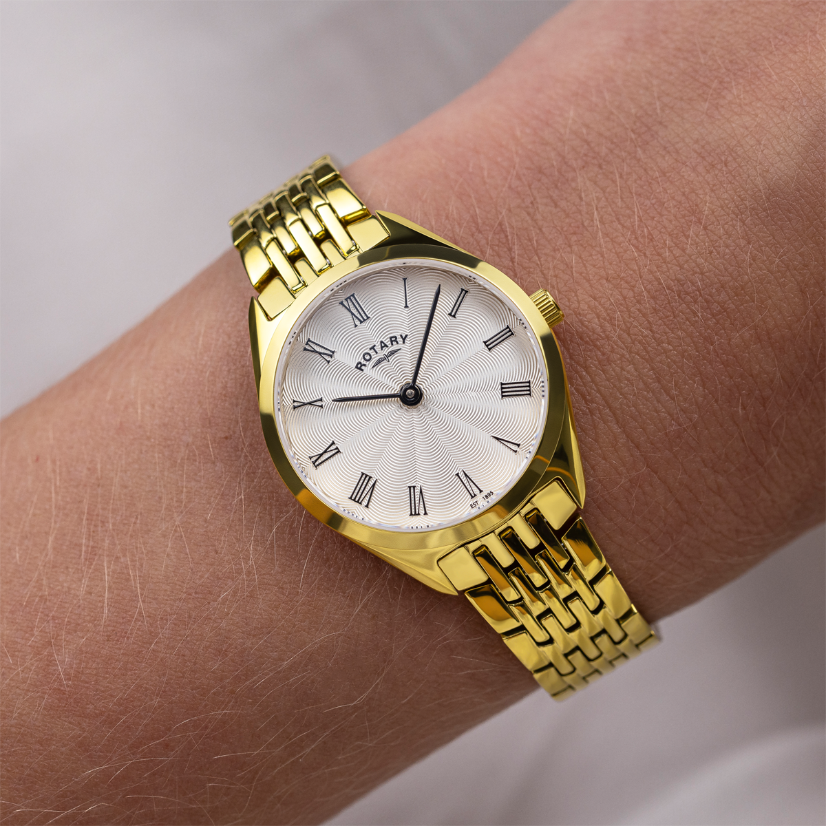 Model wears Rotary Ultra Slim, Silver Dial with Gold Plated Bracelet - LB08013/01
