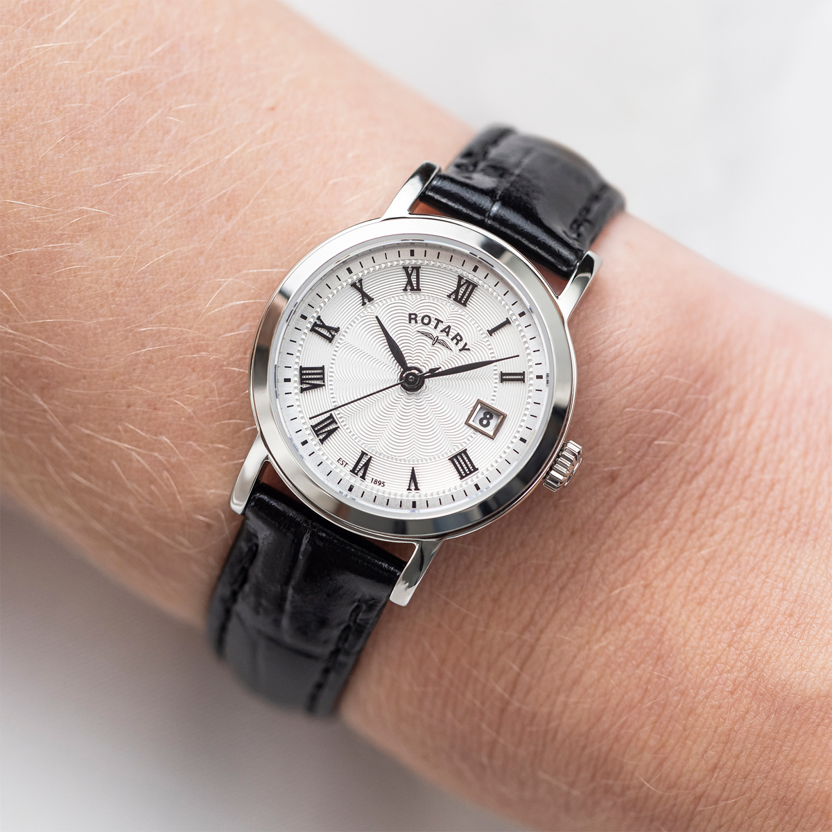 Model wears Rotary Heritage Ladies Stainless Steel Watch, White Dial with Black Leather Strap - LS05420/01