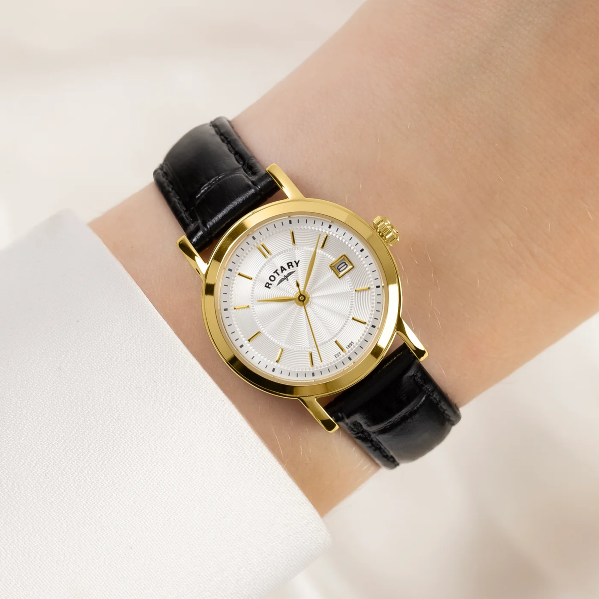 Model wears Rotary Heritage Ladies Watch, White Dial with Black Leather Strap LS05423/70