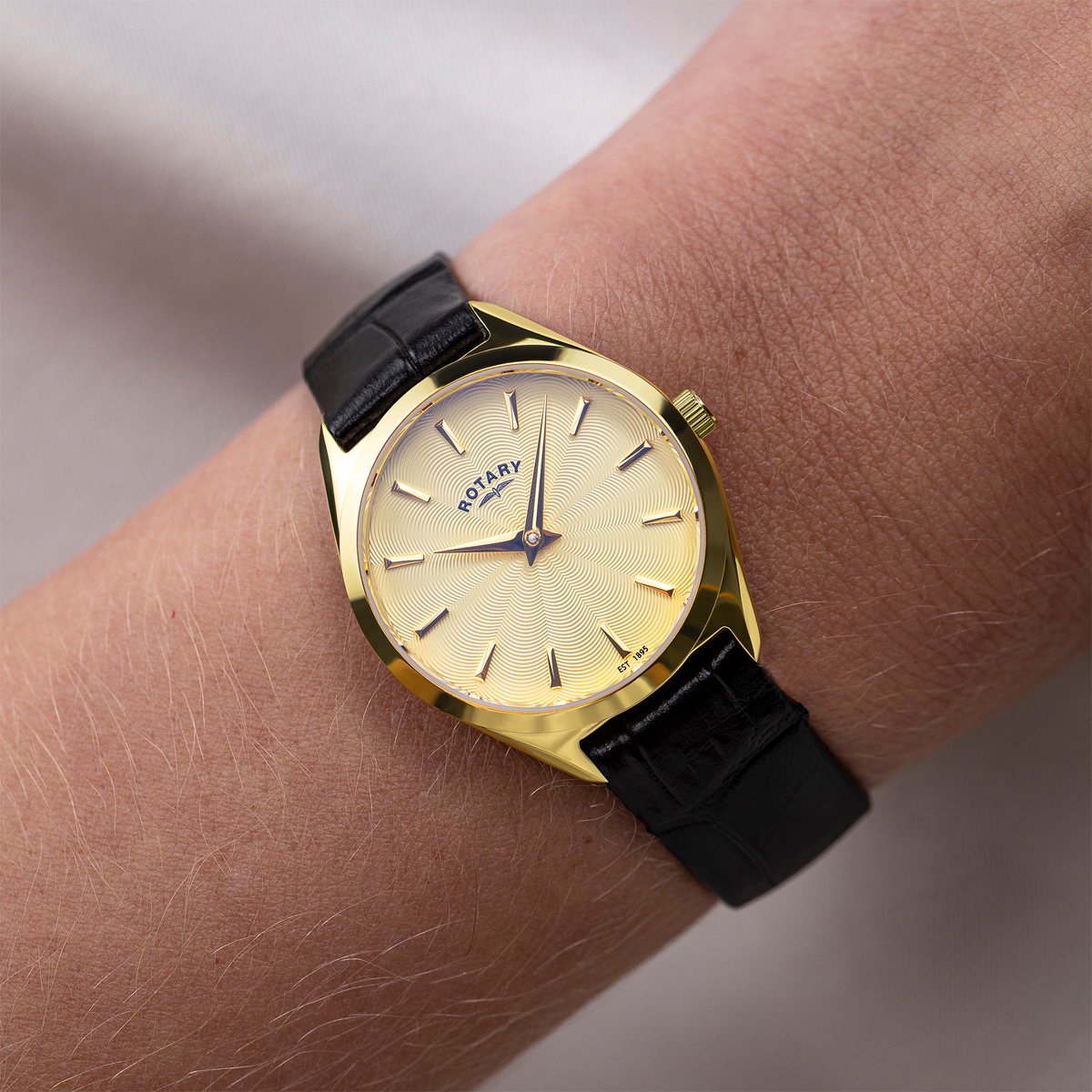 Model wears Rotary Ultra Slim, Gold Dial with Black Leather Strap - LS08013/03