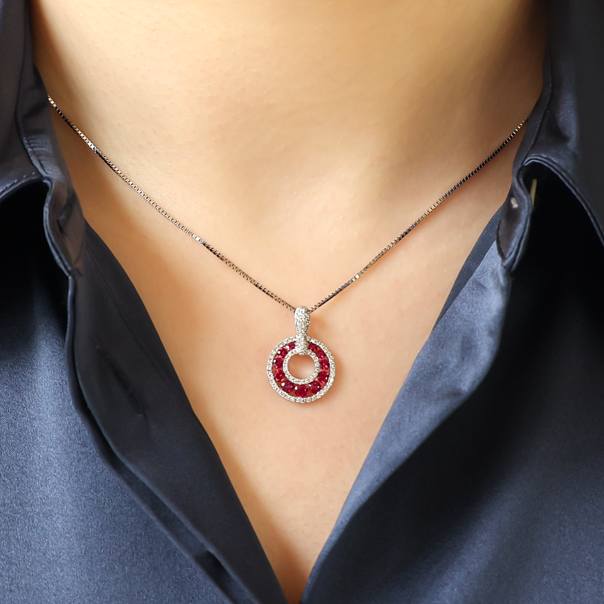 Model wears 18ct White Gold Ruby & Diamond Circle of Life Necklace
