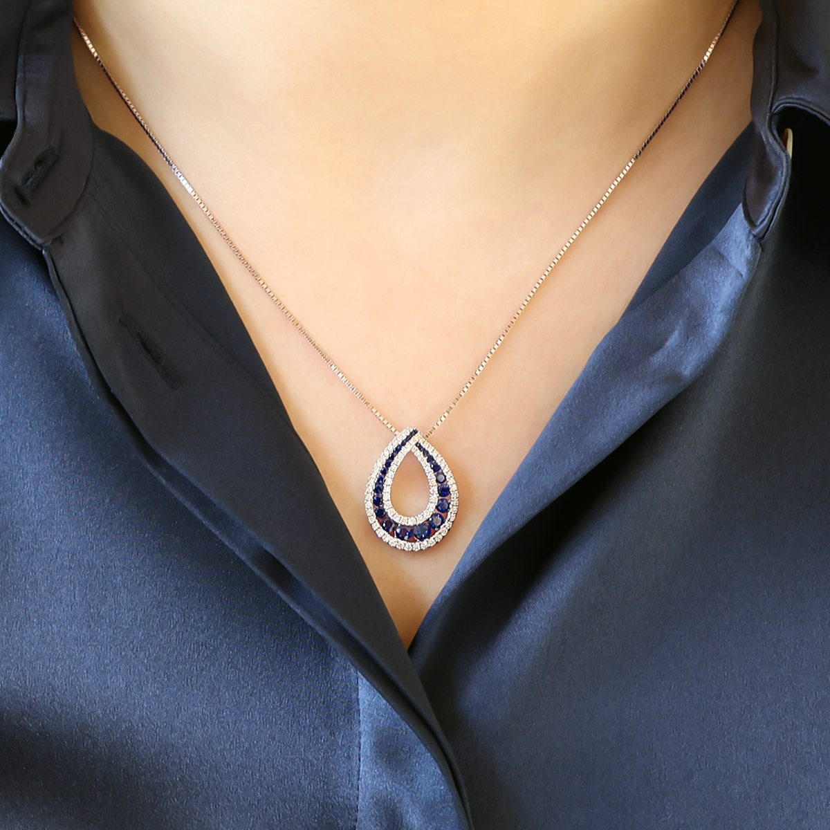Model wears 18ct White Gold Sapphire & Diamond Open Teardrop Necklace