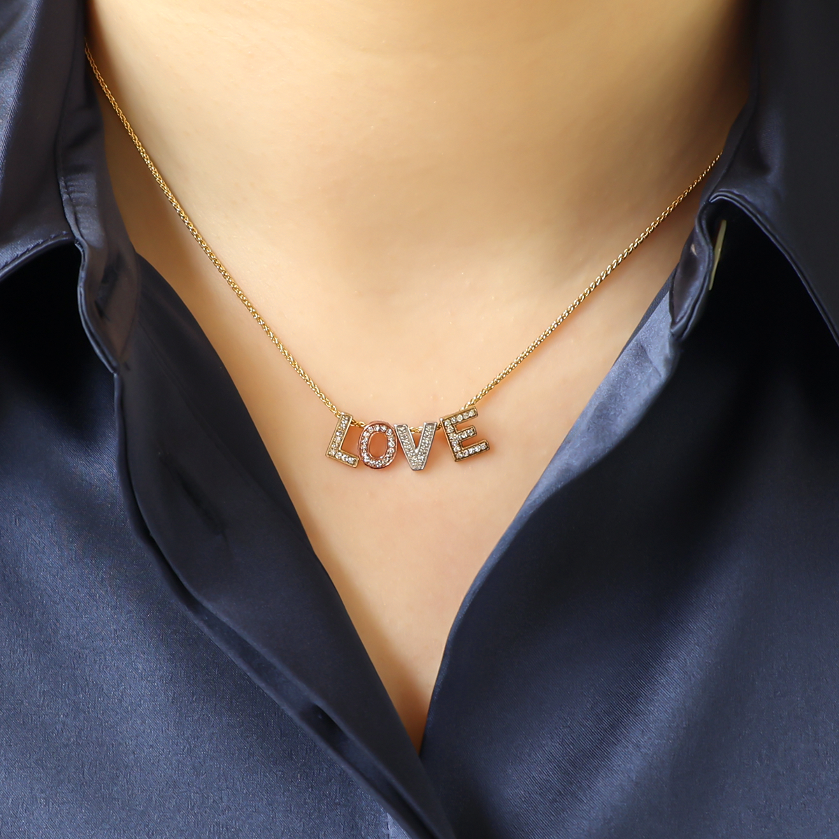 Model wears 9ct Three Colour Gold Diamond Set 'LOVE' Necklace