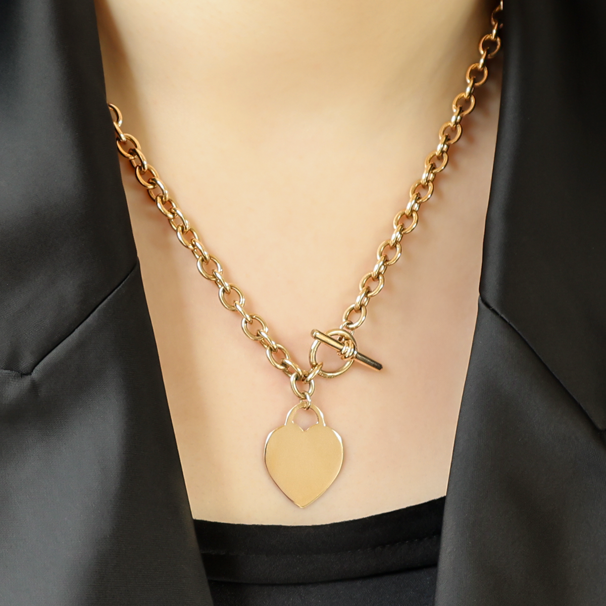 Model wears 9ct Yellow Gold 18” Solid Oval Belcher Heart Tag T-Bar Necklace