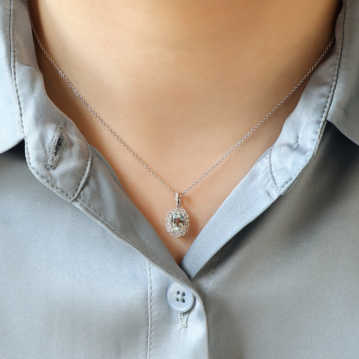 Model wears 18ct White Gold Aquamarine & Diamond Oval Cluster Pendant & Chain