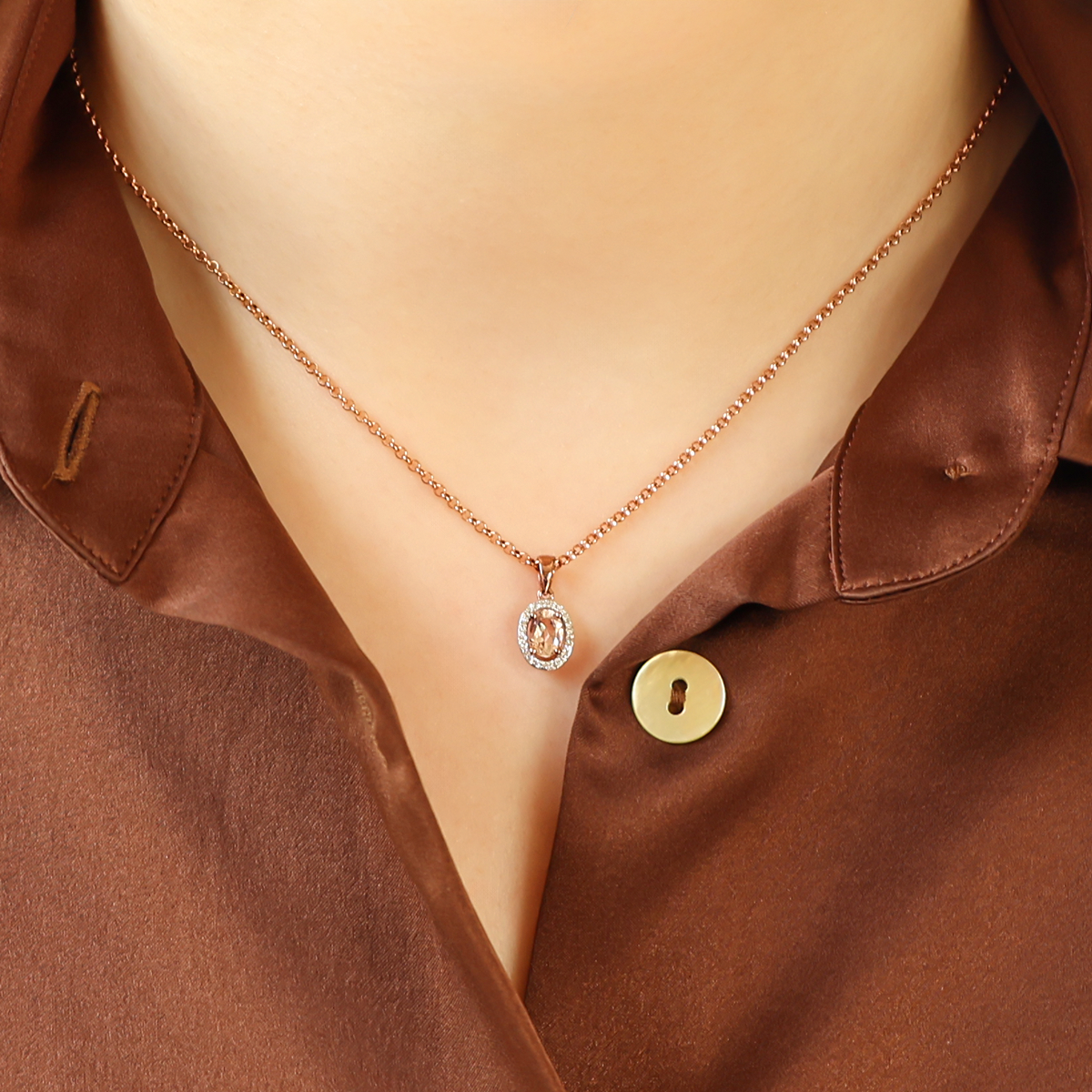 Model wears 9ct Rose Gold Oval Morganite & Diamond Halo Cluster Pendant & Chain