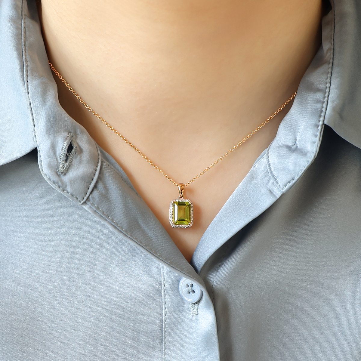 Model wears 9ct Yellow Gold Octagonal Peridot & Diamond Halo Pendant & Chain