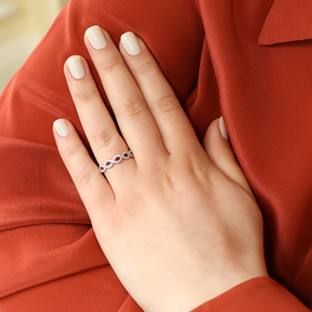 Model wears 18ct Yellow Gold Ruby & Diamond Infinity Ring