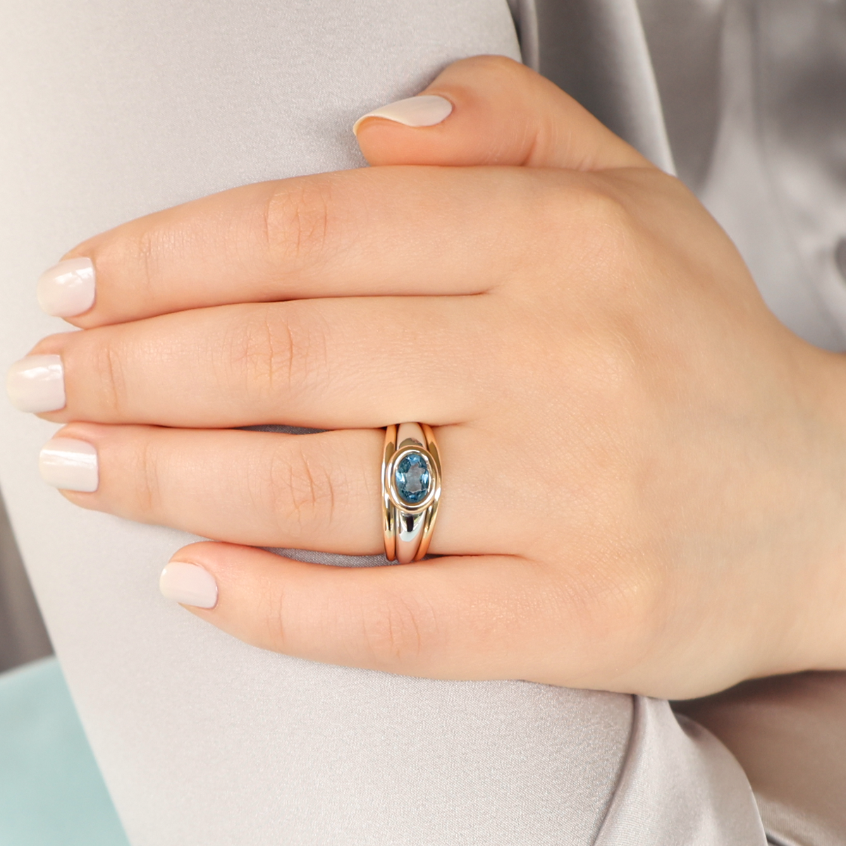 Model wears 9ct Two Colour Gold Oval Shaped Blue Topaz Signet Ring