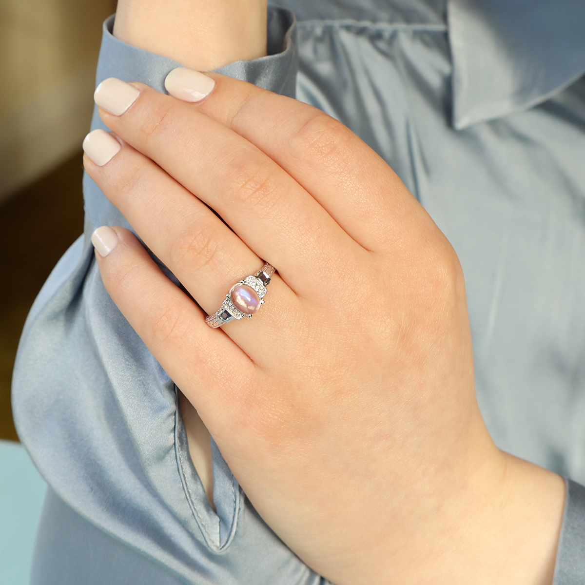 Model wears 14ct White Gold Moonstone, Sapphire & Diamond Dress Ring