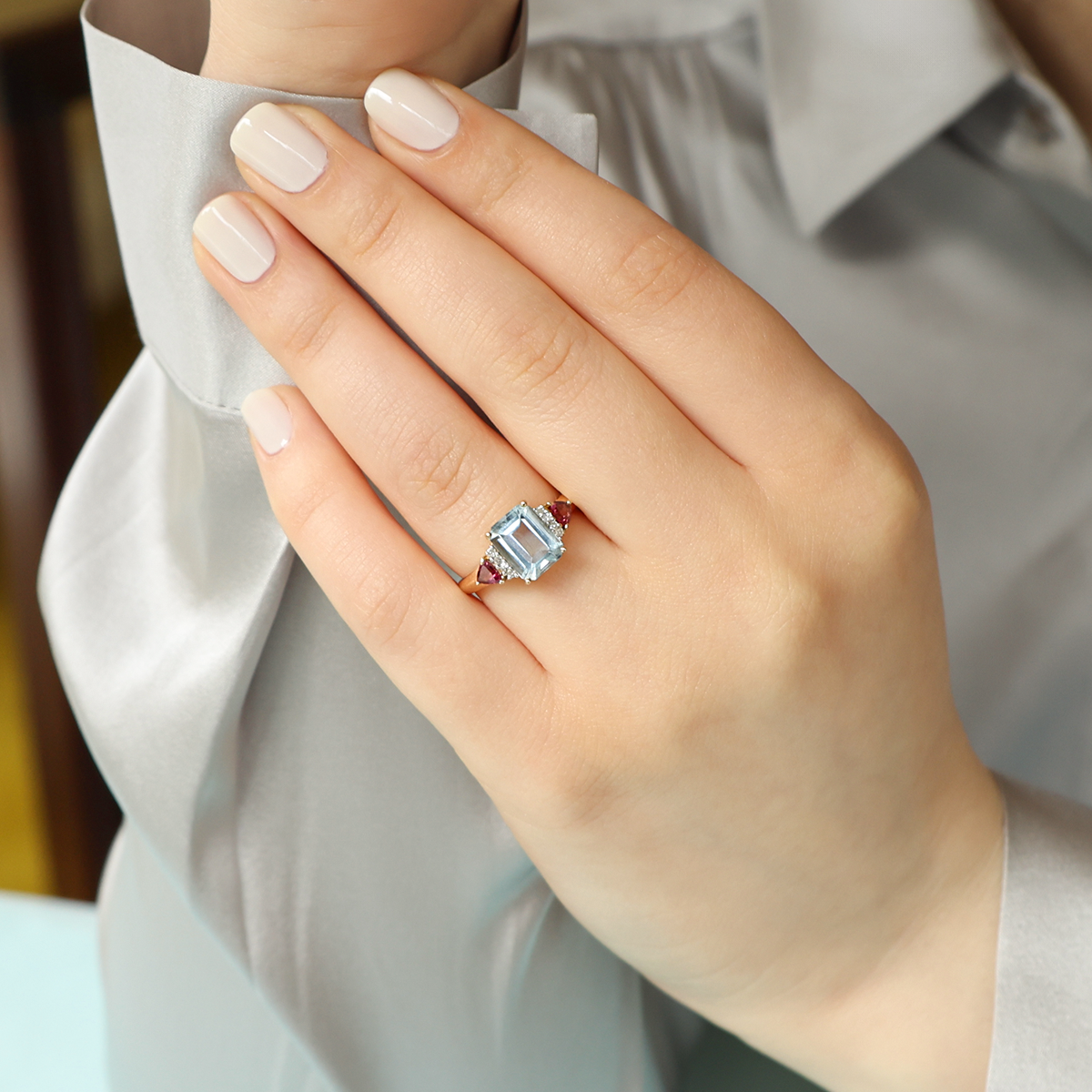 Model wears 14ct Yellow Gold Emerald Cut Aquamarine, Pink Tourmaline & Diamond Shoulders Ring  