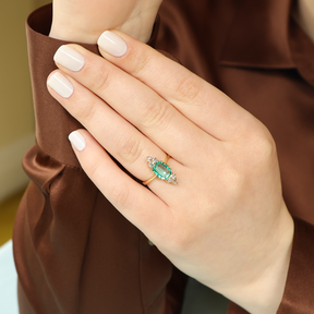 Model wears Un-hallmarked 18ct Yellow Gold Emerald & Old Cut Diamond Navette Ring