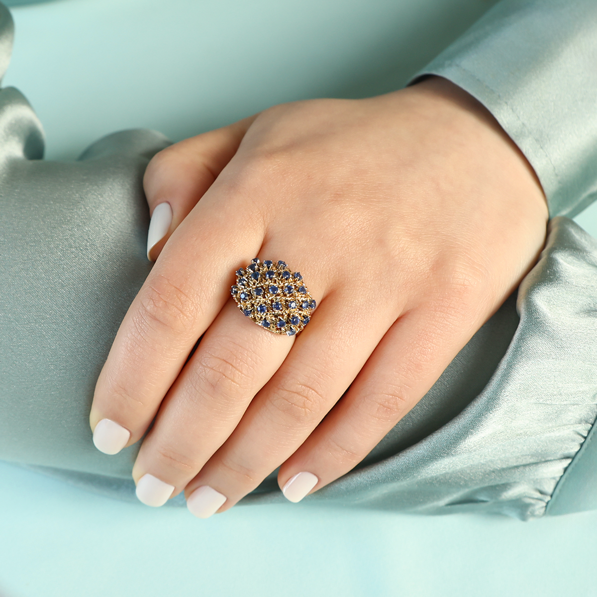Model wears 18ct Yellow Gold Sapphire Lattice Bombé Ring