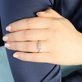 Model wears 18ct White Gold 0.67cts Emerald Cut Diamond Five Stone Ring