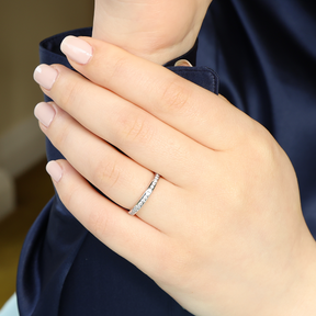 Model wears 18ct White Gold Round Brilliant Cut Certified 0.33cts Diamond Channel Set Band