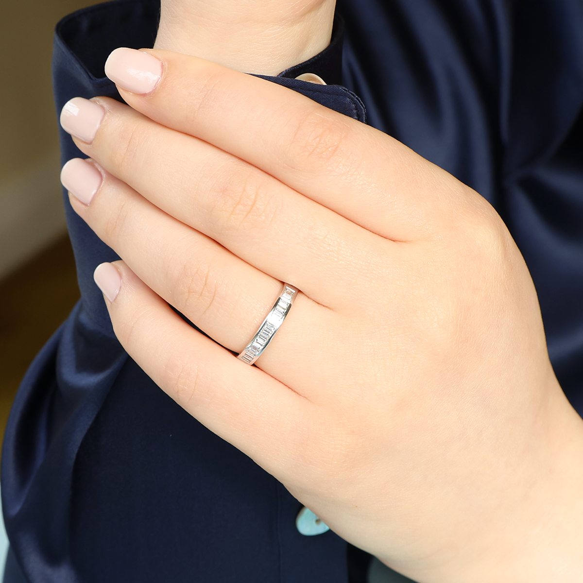 Model wears 18ct White Gold Baguette Cut Certified 0.56cts Diamond Channel Set Band