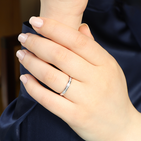 Model wears 18ct White Gold Princess Cut Certified 0.20cts Diamond Channel Set Band