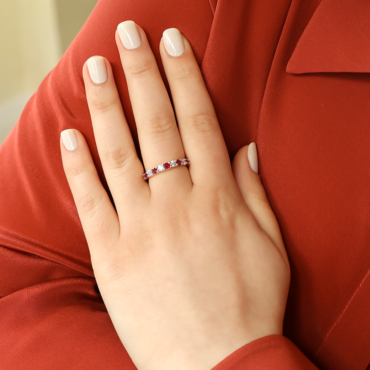 Model wears 18ct White Gold Ruby & 0.41cts Diamond Claw Set Eternity Ring