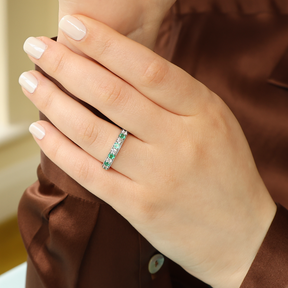 Model wears 18ct White Gold 0.54cts Diamond & Emerald Mille-Grain Set Eternity Ring