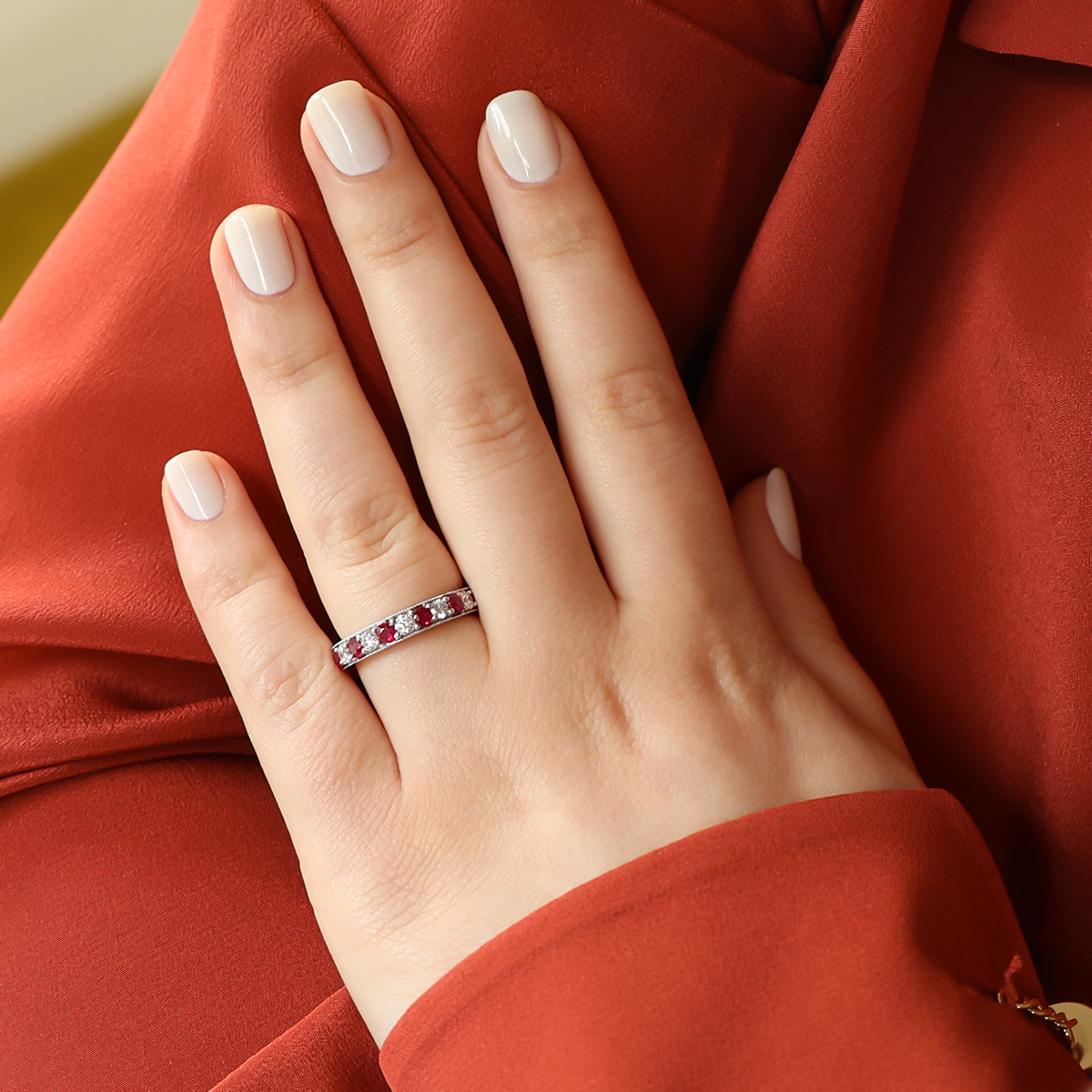 Model wears 18ct White Gold 0.54cts Diamond & Ruby Mille-Grain Set Eternity Ring