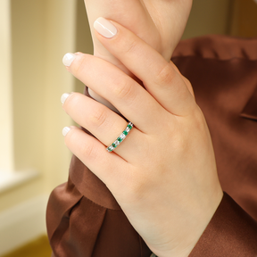 Model wears 18ct Yellow Gold 0.40cts Diamond & Emerald Mille-Grain Set Eternity Ring