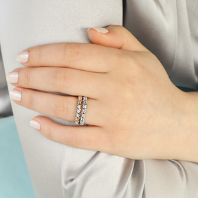 Model wears 9ct Yellow Gold Blue Topaz & 0.23cts Diamond Bar Set Eternity Ring & 9ct White Gold Blue Topaz & 0.23cts Diamond Bar Set Eternity Ring